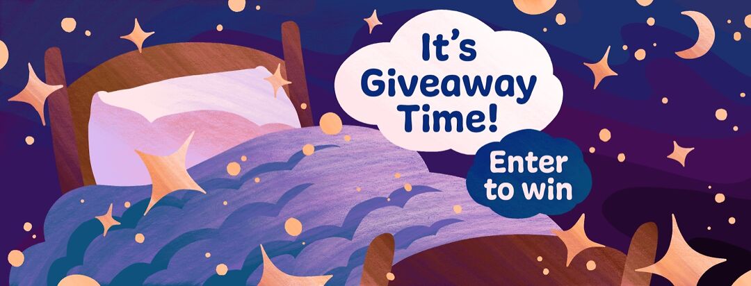 A blanket rests on a bed surrounded by sparkling stars with the text "It's giveaway time! Enter to win".